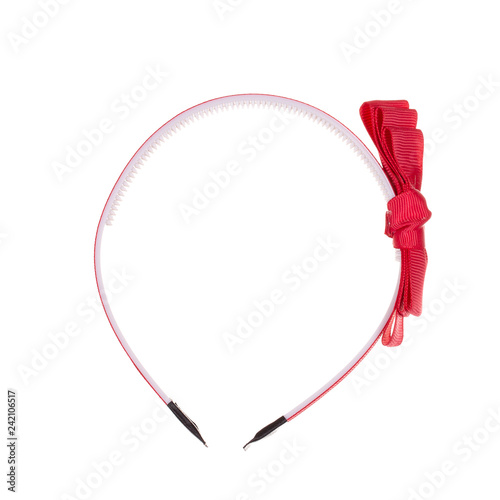 Hair band with red ribbon isolated against white background