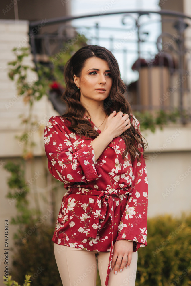 Attractive young lady poses to photographer. Outside. model Attractive young lady poses to photographer. Outside. model