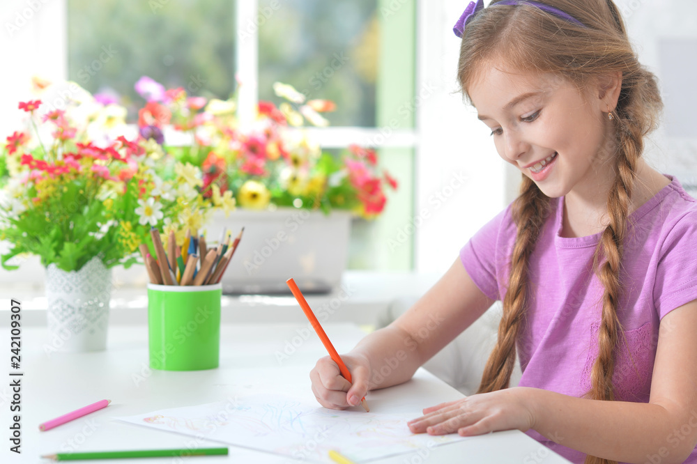 Portrait of girl painting with pencil in room Portrait of girl painting with pencil in room