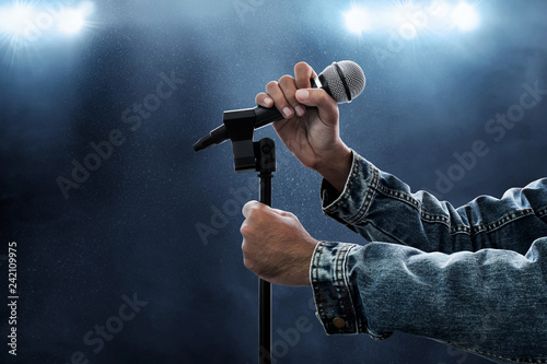 Hands holding microphone
