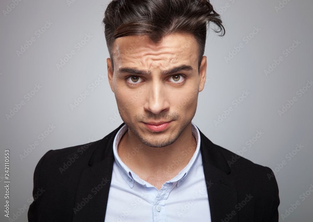 portrait of frustrated businessman in black suit standing portrait of frustrated businessman in black suit standing