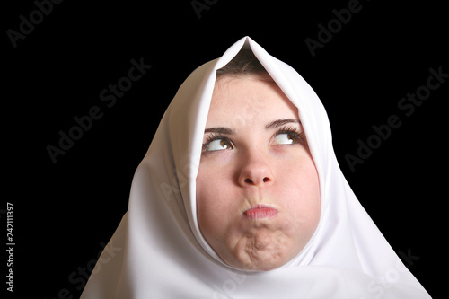 young woman funny surprised nun in white isolated on black background facial portrait