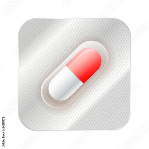 Red and white medicine capsule, pill in blister on white
