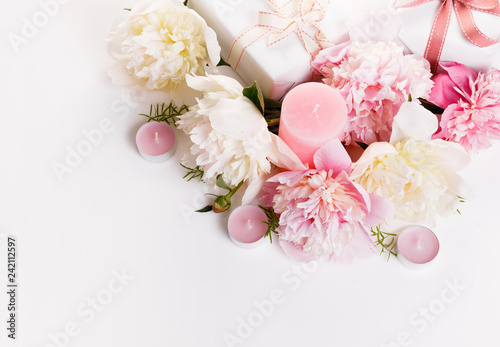 Delicate white pink peony with petals flowers and white ribbon on wooden board. Overhead top view, flat lay. Copy space. Birthday, Mother's, Valentines, Women's, Wedding Day concept