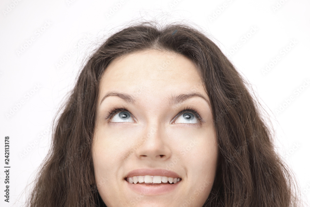 closeup.a young woman with confidence looks up at copy space closeup.a young woman with confidence looks up at copy space