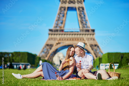 Couple having picnic near the Eiffel tower in Paris © Ekaterina Pokrovsky