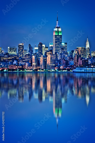 New York skyline with water reflections  at night