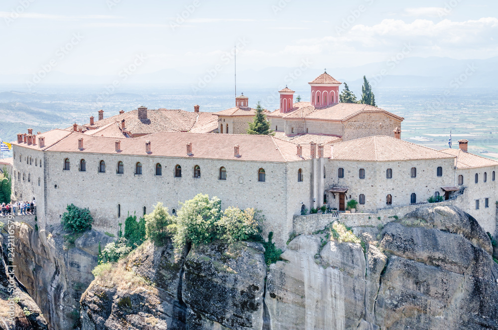 Naklejka premium Kalambaka, Greece - June 10, 2018: A group of Orthodox monasteries Meteora, near the town of Kalambaka at the northwestern edge of the Plain of Thessaly.