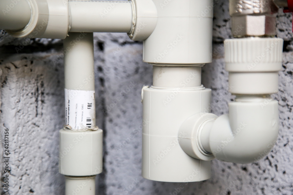 Close up of manometer, pipe, flow meter, water pumps and valves of heating system in a boiler room at home Close up of manometer, pipe, flow meter, water pumps and valves of heating system in a boiler room at home