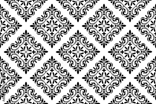Wallpaper in the style of Baroque. Seamless vector background. White and black floral ornament. Graphic pattern for fabric, wallpaper, packaging. Ornate Damask flower ornament