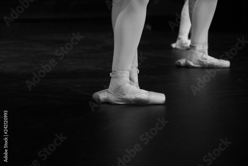 Closeup legs of ballerinas during a performance.Ballet dancers.