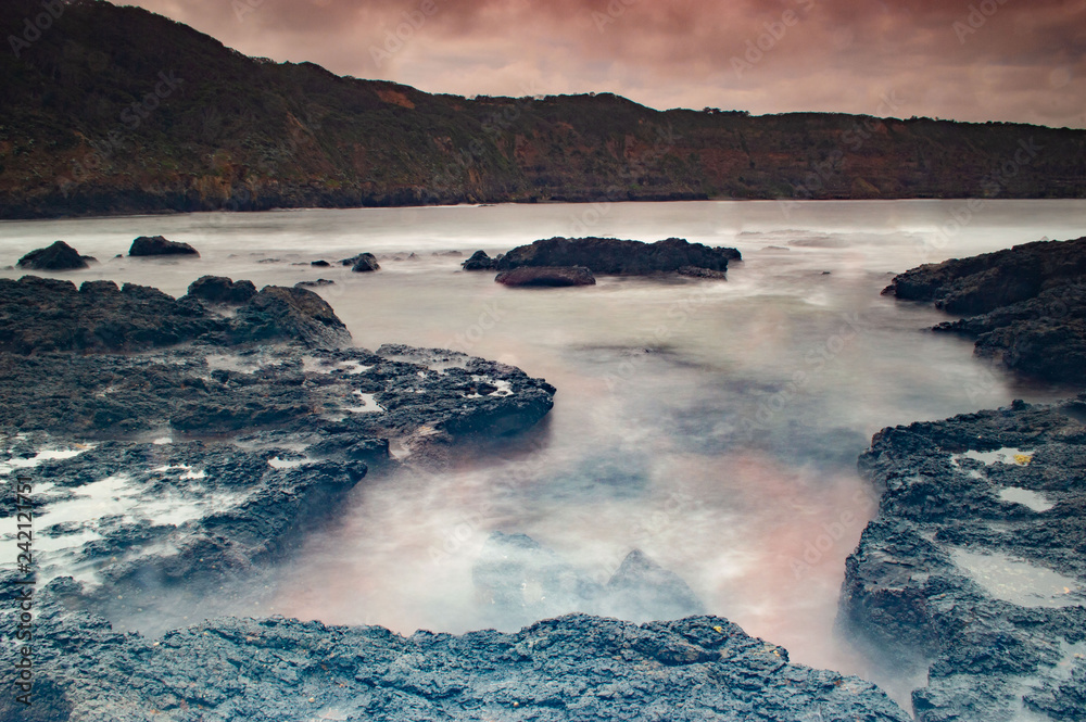 Naklejka premium Sea Beach with Rocky Coastline