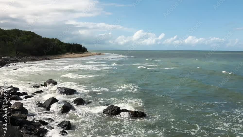 Ocean waves by the Pebbly beach in Australia Ocean waves by the Pebbly beach in Australia