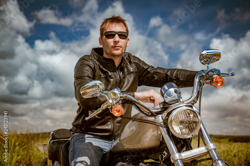 Biker on a motorcycle photo