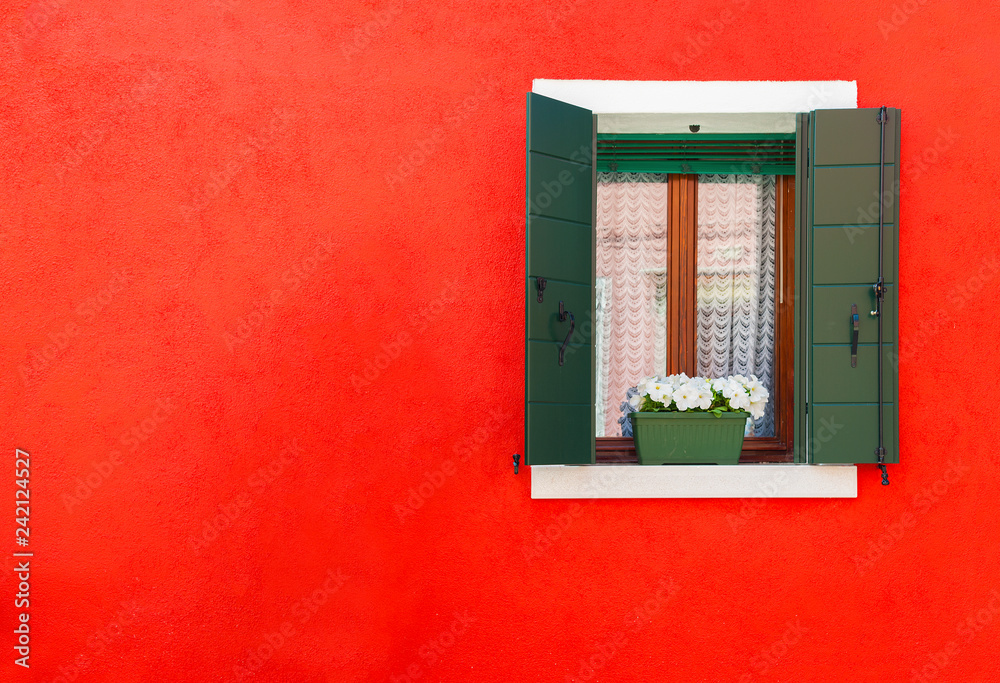 Colorful wall and window of residential house in Burano island, Venice, Italy Colorful wall and window of residential house in Burano island, Venice, Italy