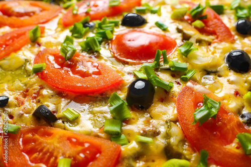 Pizza with olives. Hot delicious pizza with tomatoes, cheese, olives and green onions