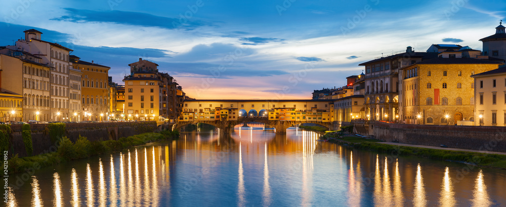 Ponte Vecchio - the bridge-market in the center of Florence, Tuscany, Italy at dusk