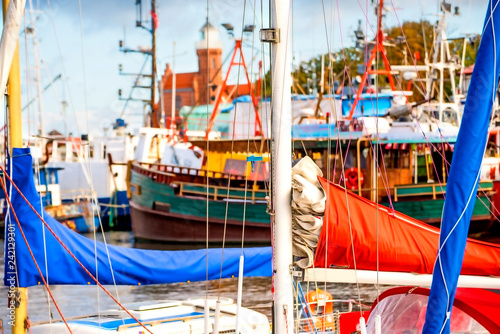 Fishing port of Ustka, Poland with old lighthouse photo