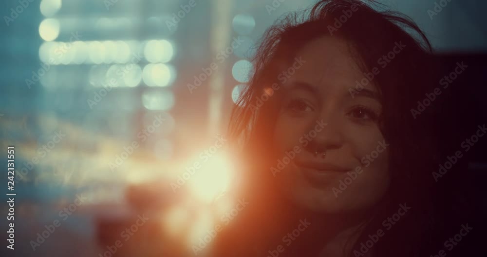 young woman looking slide show using a photo slide projector