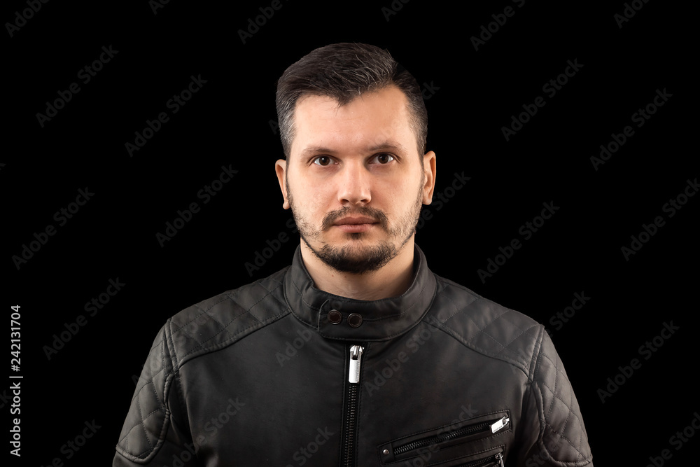 young man close up portrait, on black background young man close up portrait, on black background
