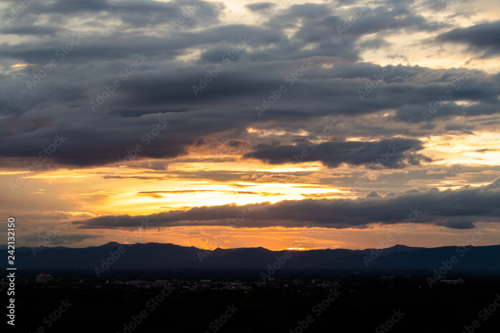 colorful dramatic sky with cloud at sunset.