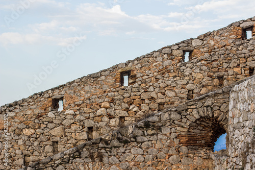 diagonal line board between stone and brick castle fortification wall construction and gray sky background wallpaper pattern  copy space  