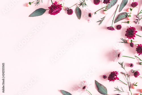 Flowers composition. Eucalyptus leaves and pink flowers on pastel pink background. Flat lay, top view, copy space © Flaffy