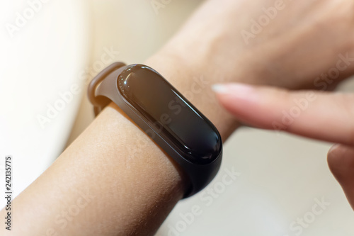 Close up image hand of male using smart watch app. Business, technology and people concept