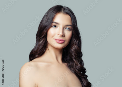 Young woman with curly hairstyle, fashion portrait