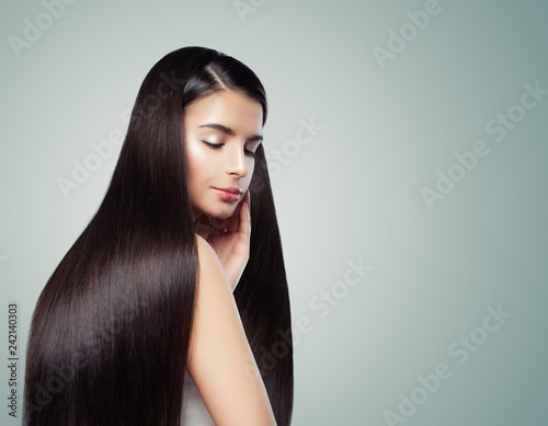 Brunette girl with long dark brown straight hair, haircare concept