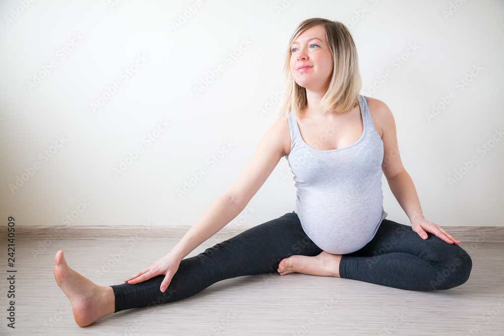 happy pregnant woman stretching
