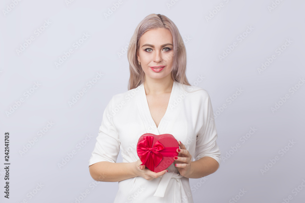Blonde woman with gift red heart box Blonde woman with gift red heart box