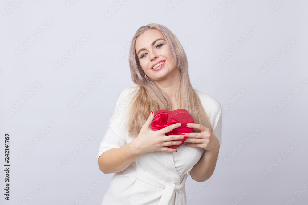 Blonde woman with gift red heart box Blonde woman with gift red heart box