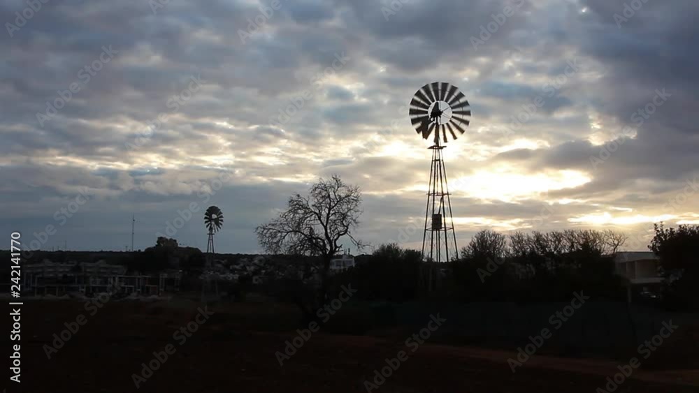 Two old windmill on sunset, one working. Cyprus countryside, Protaras. Two old windmill on sunset, one working. Cyprus countryside, Protaras.