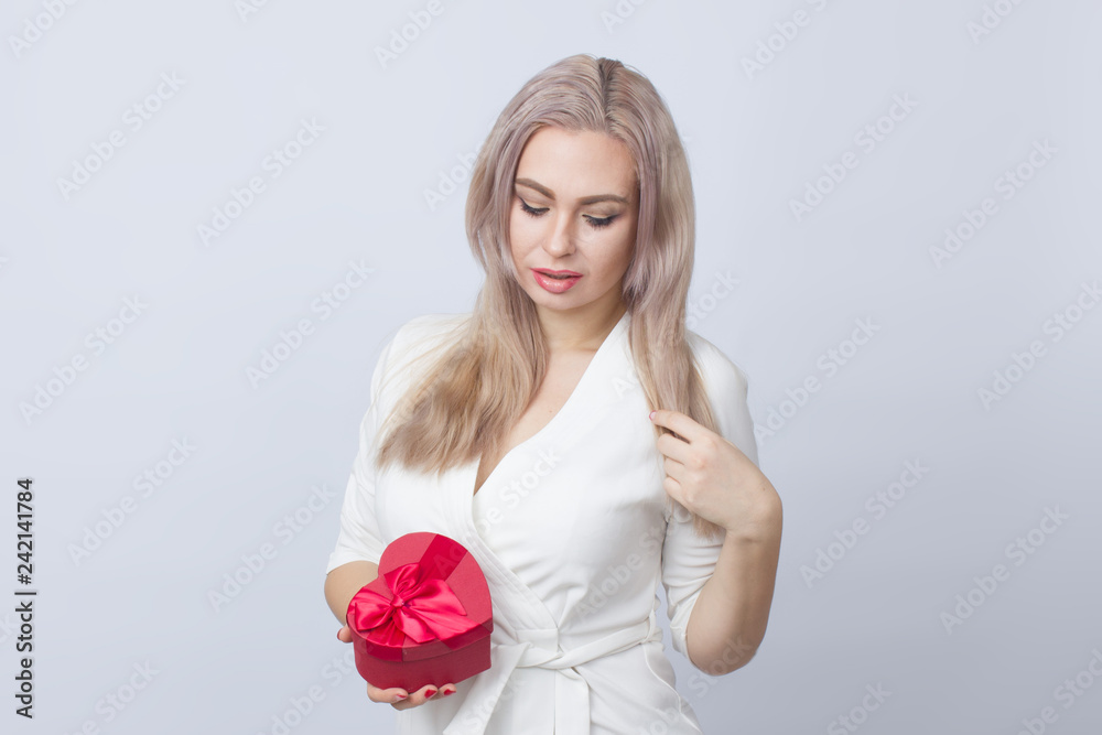 Blonde woman with gift red heart box Blonde woman with gift red heart box