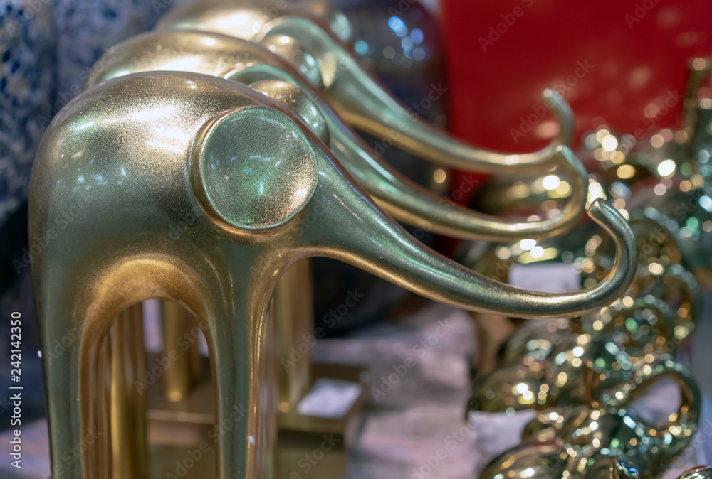 Decorative golden statuettes of elephants in the gift shop. Decorative golden statuettes of elephants in the gift shop.