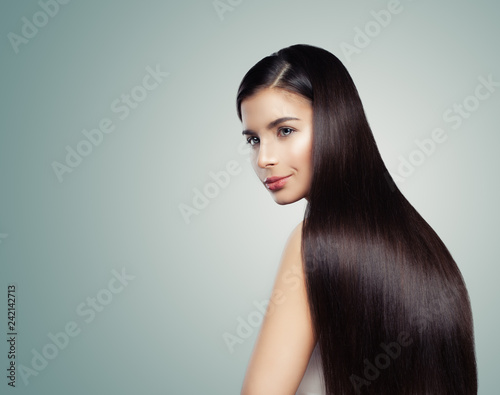 Cheerful woman with shiny hair. Gorgeous woman with straight hairstyle