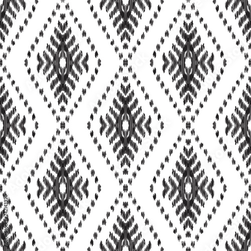 Ethnic seamless pattern. Boho ikat ornament. Can be used for textile, wallpaper, wrapping paper, greeting card background, phone case print. Black and white vector illustration. Tribal graphic design.