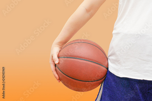 girl holds Basketball ready to play. 