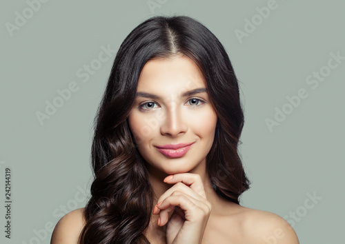 Attractive young woman smiling. Perfect female face