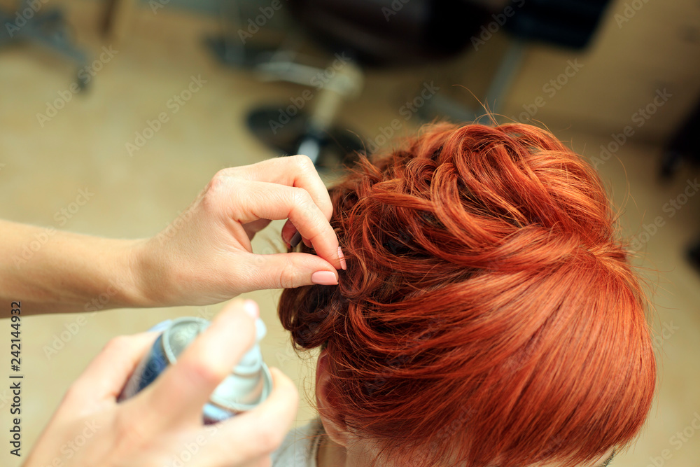 Hairdresser makes beautifull hairstyle at the salon c Hairdresser makes beautifull hairstyle at the salon c
