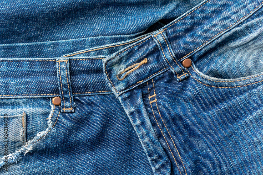 Old torn blue jeans pocket .Texture or background. Old torn blue jeans pocket .Texture or background.