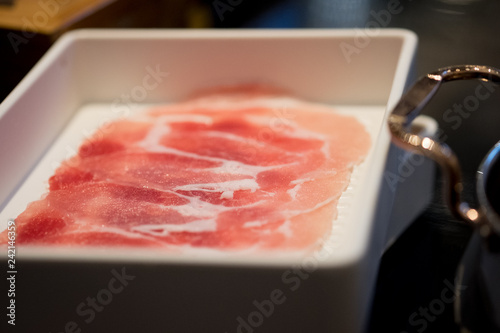 Closeup red raw sliced of pork