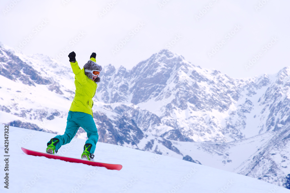 Snowboarder running down slope Snowboarder running down slope