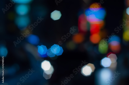 Abstract blurred textures surface pattern design bright colorful glitter geometry octagon bokeh background of Lighting from cars on the road and decorative light in the city at night time