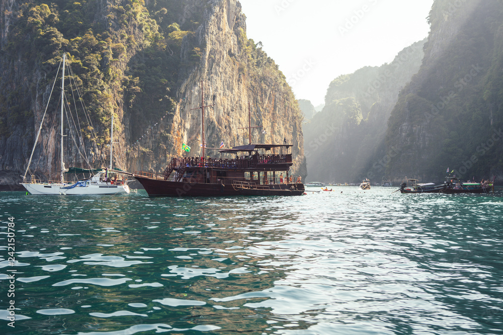 Boat on the sea with rocks on background Boat on the sea with rocks on background