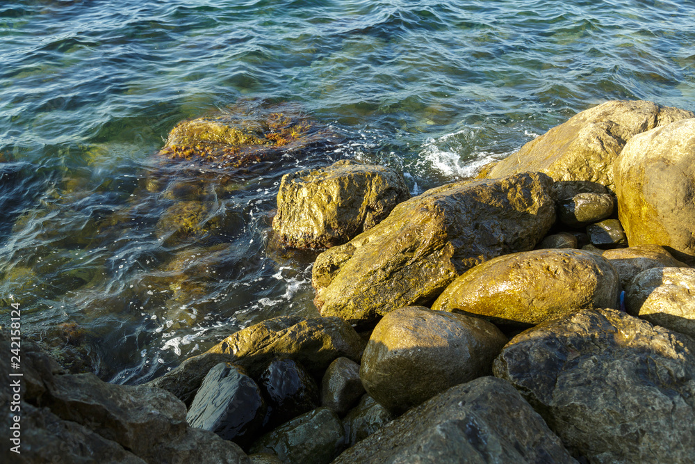 Large stones and fragments of rocks in the sea.