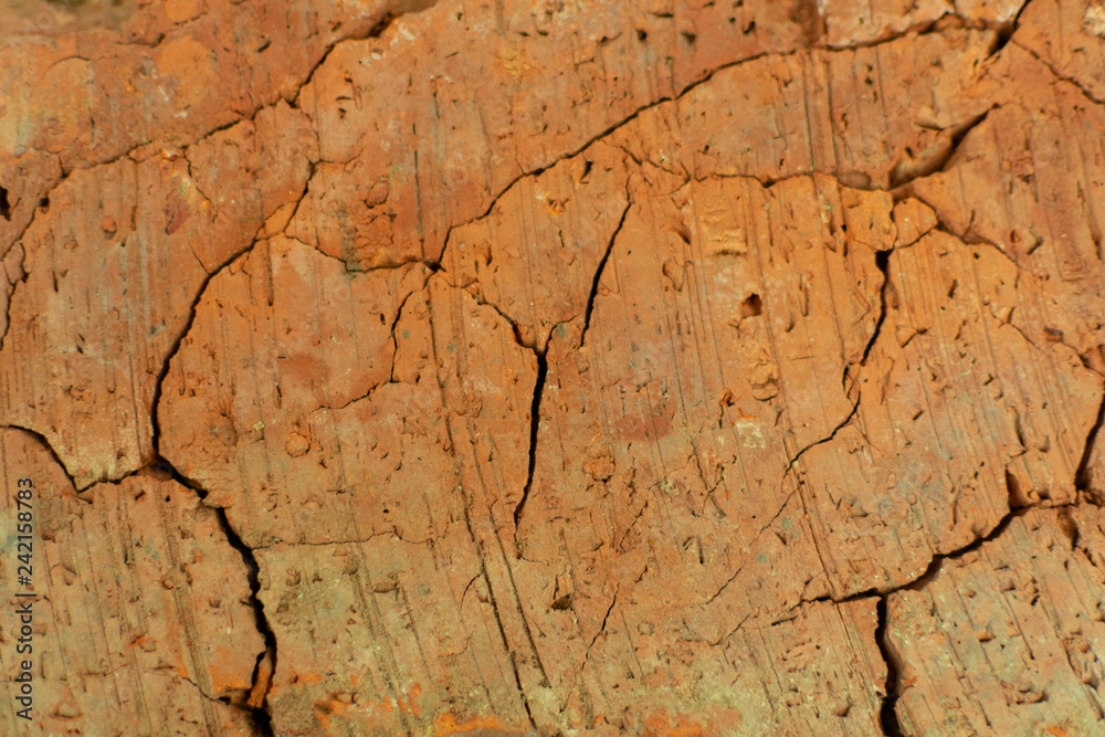 texture of old cracked red brick during firing from clay, close-up
