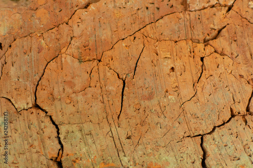 texture of old cracked red brick during firing from clay, close-up