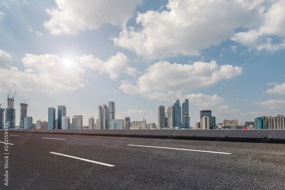 Empty asphalt road along modern commercial buildings in China,s cities